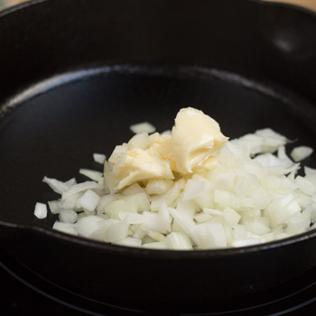 Onions and margarine in a heated non-stick pan