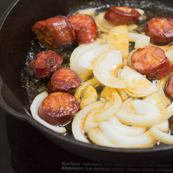Onions and chorizo in a pan.