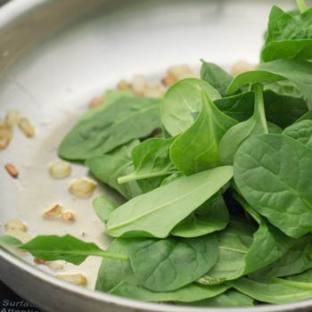 Fresh spinach in a pan.