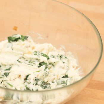 Spinach ricotta mix in a bowl.