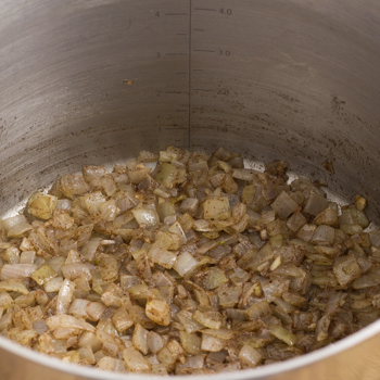 Onions sauteed in pot.