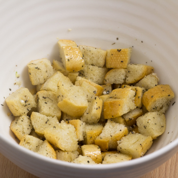 Croutons tossed in thyme, salt, and margarine.